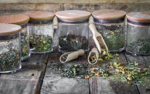 Four Jars Filled With Dried Herbs