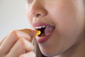 Woman Taking Supplement